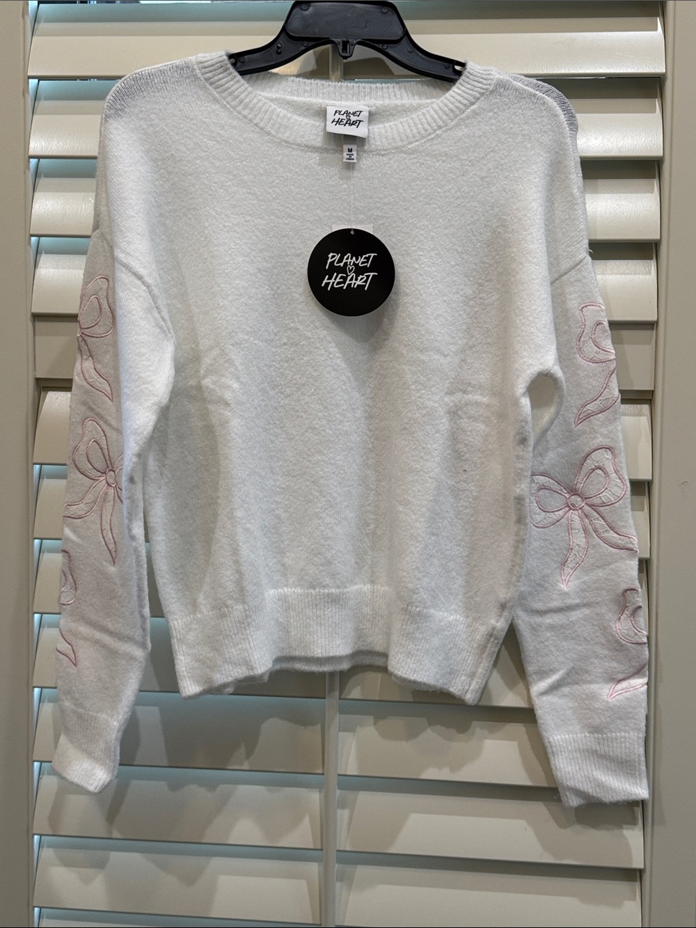Planet Heart Crewneck Sweater with Pink Bow Sleeve Detail